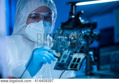 Microelectronics Engineer Works In A Modern Scientific Laboratory On Computing Systems And Microproc