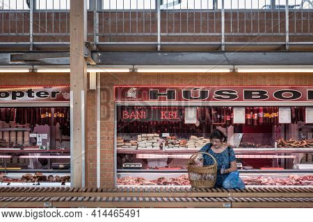 Szeged, Hungary - July 21, 2017: Woman Packing Food In Front Of A Butcher Shop (husbol) In Szeged Co