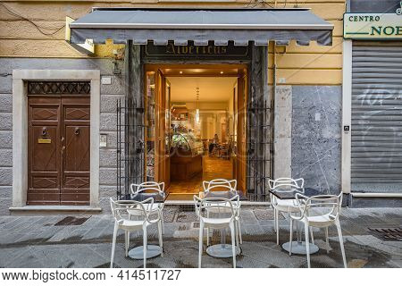 Carrara, Massa Carrara,italy - October, 2020: Cityscape. View Of Small Open Door Bar 
