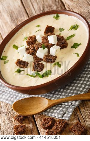 Soup From Sheep Cheese And Potatoes Demikat Served With Croutons Closeup In The Plate On The Table. 