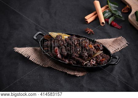 Beef Roast Or  Pothu Ulartheyadu, Kerala Special Dish Arranged In An Black Table Ware And In Banana 