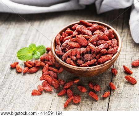 Dry Red Goji Berries For A Healthy Diet On A Old Wooden Background