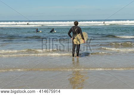 Practicing Surf On Famara Beach At Lanzarote In Canary Islands, Spain