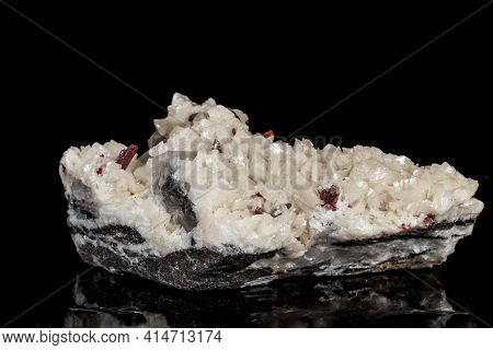 Macro Stone Cinnabar Dolomite Mineral On A Black Background