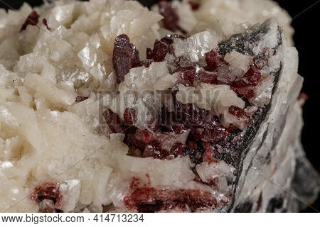 Macro Stone Cinnabar Dolomite Mineral On A Black Background