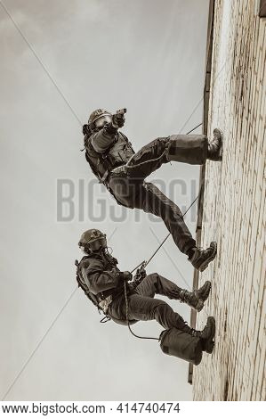 Two Commandos Train At The Base. Climbers. Swat, Police, Counterterrorism Concept. Mixed Media
