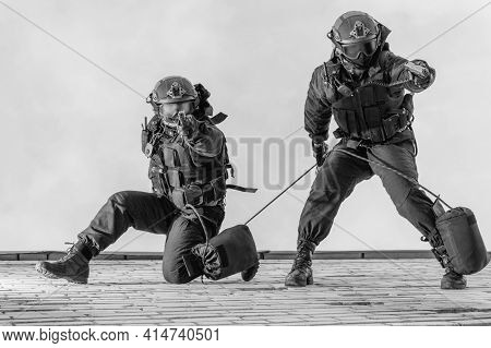 Two Commandos Train At The Base. Climbers. Swat, Police, Counterterrorism Concept. Mixed Media