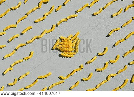 Italian Fusilli, Rotini Or Scroodle Macaroni Pasta Food Background Texture. Top View, Pasta Spirals 