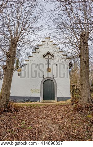 Facade Of The Chapel Of The Hermitage In Schaelsberg In The Dutch Countryside, Surrounded By Bare Tr