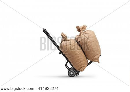 Studio shot of two burlap sacks on a hand truck isolated on white background