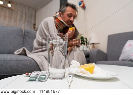Close-up Of Sars Covid19 Influenza Cold Treatment Medicine And Vitaminc Immunity Lemon Glass Of Wate