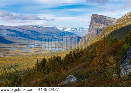 Wild, Beautiful Arctic Landscape Of Northern Sweden. Skierfe Mountain And Rapa River Valley In Early