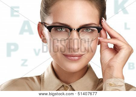 Close Up Of A Young Smiling Beautiful Woman Wearing Eyeglasses