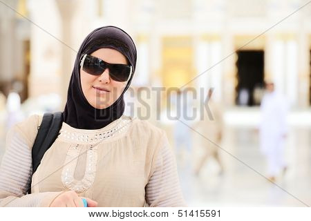 Muslim Arabic woman portrait outdoors in holy mosque