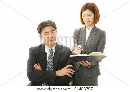 Dissatisfied businessman and businesswoman