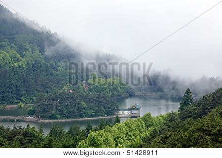 Clouds And Mist Floating In The Lake