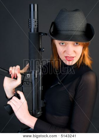Young Woman Holding The Gun