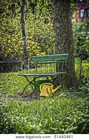 Garden Bench With Yellow Ewer
