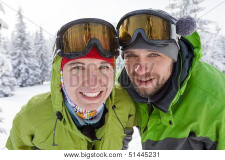 Two Funnny Hikers Posing At Camera In Winter Mountains