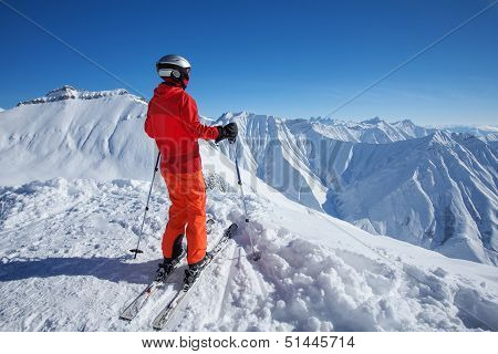 Skier Is Posing At Camera At Gudauri Resort In High Mountaing Of Georgia, Caucasus