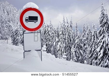 Stop traffic sign in the snowy forest