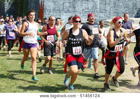 MUSKOGEE, OK - SEPT.14:  Athletes and actors portraying zombies participate in the first annual Zombie Run at the Castle of Muskogee in Muskogee, OK. on September 14, 2013.