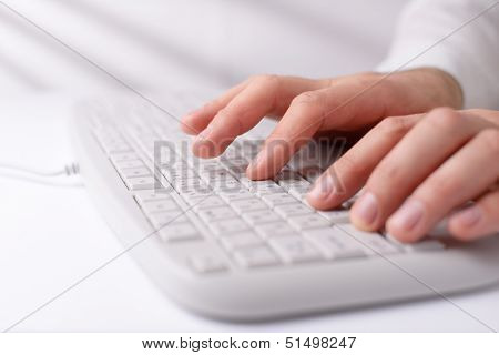 Man Typing On A Computer Keyboard