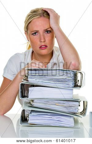 young woman in office is overwhelmed with work. burnout in work or study.