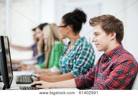 education concept - student with computer studying at school