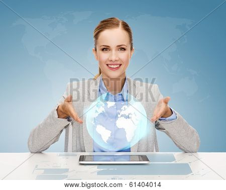 business, technology, internet and office concept - smiling businesswoman with tablet pc computer and glode hologram