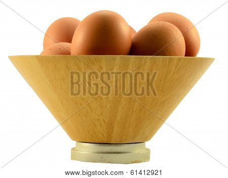 eggs on the wooden bowl