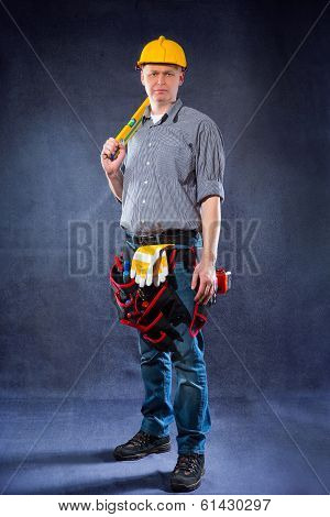 Construction worker holding a spirit level
