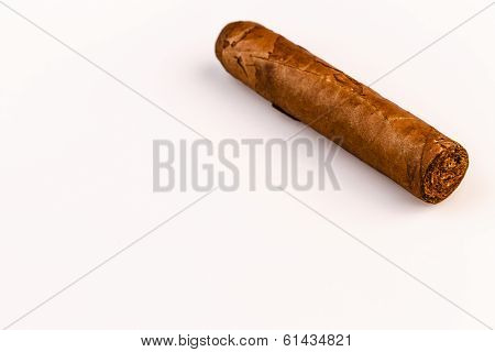 Expensive Hand-rolled Cigar On A While Background