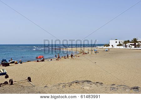 People Relax At The Beach