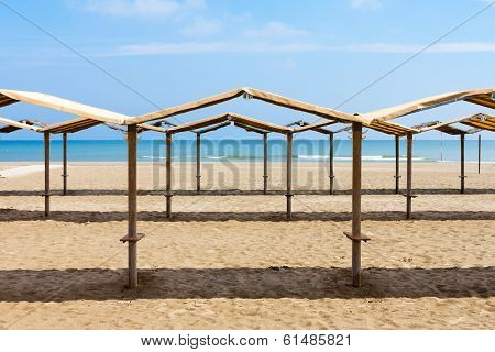Rows Of The Palm Leaf Sun Shades On The Beach