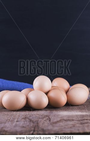 Chicken Eggs On Wooden Background