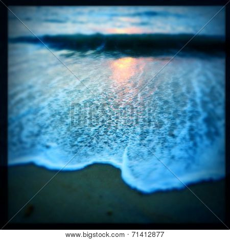 Instagram filtered image of the sunrise and surf on the Outer Banks shorline