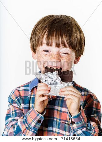 Happy Red-haired Boy With Chocolate Bar