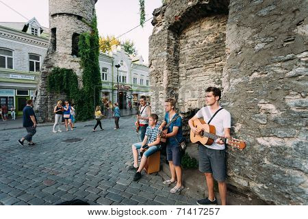 Street Musicians At The Evening Near Famous Viru Gate In Old Town Tallinn