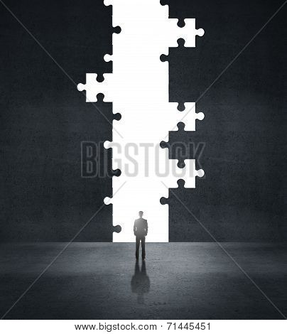 Man Looking To Puzzle Hole