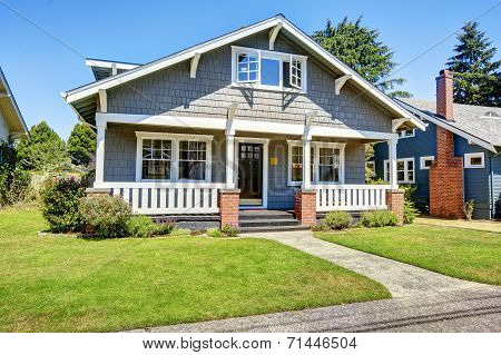 Clapboard Siding House Exterior. Large Entance Porch With Brick Trim