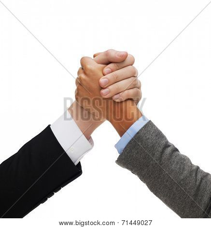 business competition concept - hands of two people armwrestling