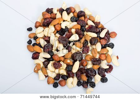 mixed nuts and dried fruits isolated on white background