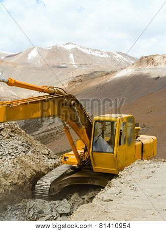 Excavator Working On A Precipice In The Himalayas