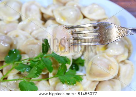 Pelmeni With Sour Cream, The Butter Ground By Pepper And Fresh Parsley