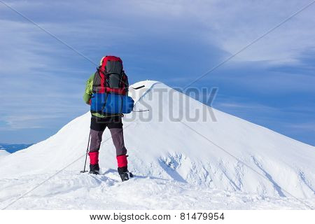 Winter hiking in the mountains .