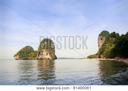 Cliffy Island In Azure Sea Water