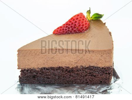 Piece Of Chocolate Cake Of Two Layers With Fresh Strawberries On Foil And White Background