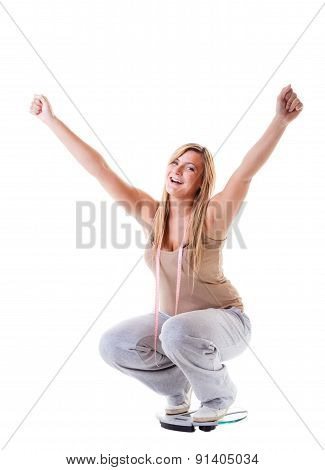Girl On Scales Celebrating Weightloss
