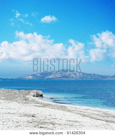 Stintino Shoreline Under A Blue Sky With Clouds